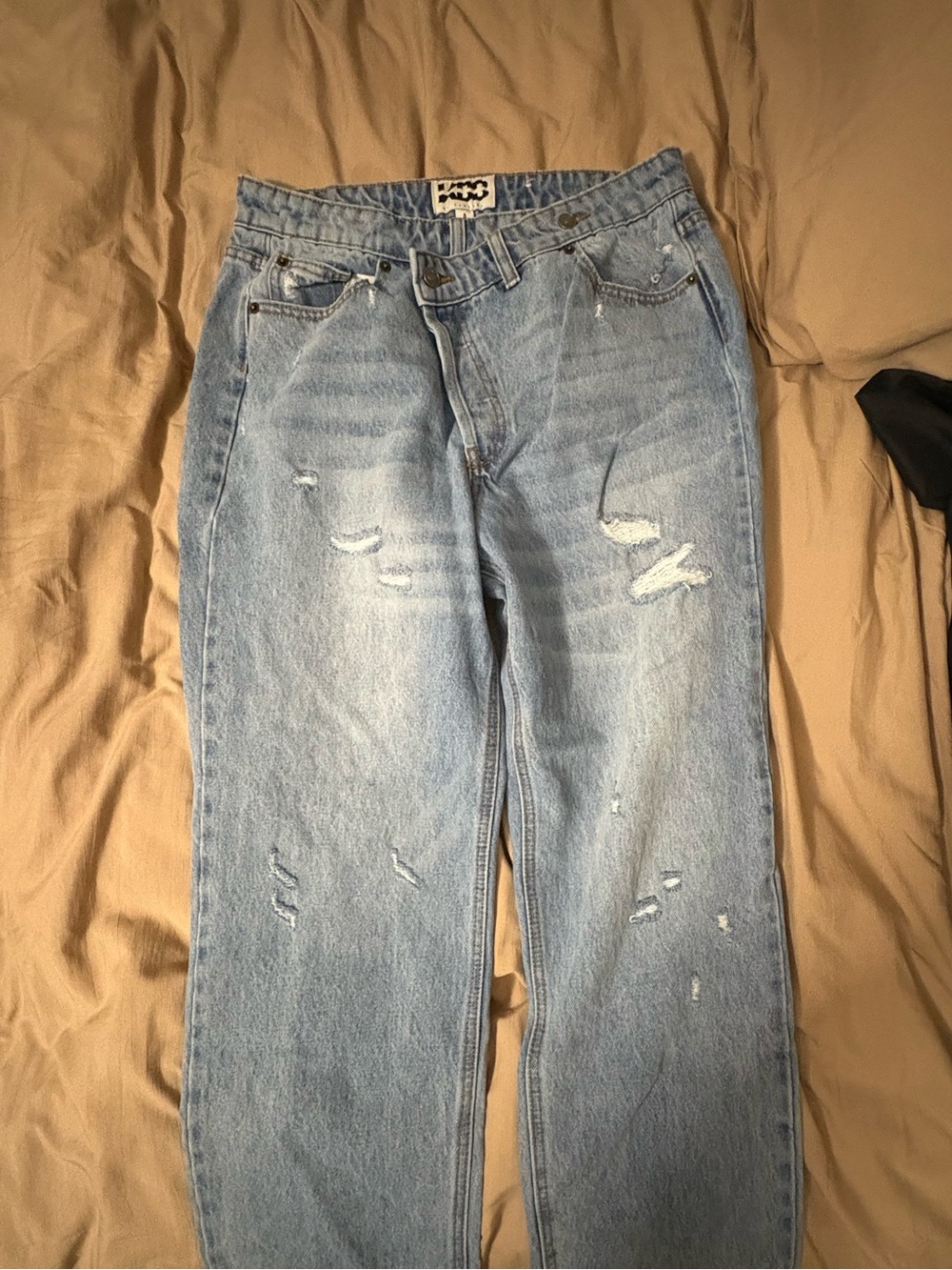 Light Blue Distressed Asymmetrical Women’s Jeans